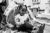 Nahile checking out her new toothbrush while waiting for the dentist at The Greater Hudson Valley Family Health Center, Center of Dental Health.
