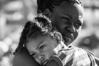 Candy Westby holding her son they live in the Gungulung neighborhood in Belize  City which is the where the poorest people live and getting access to cervical cancer screening can be challenging