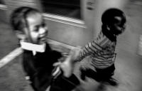 Paulette's two children racing through the hallways of the shelter.  The average age of a homeless person in America is nine years old.
